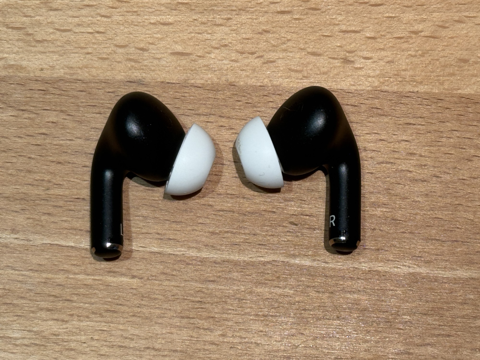 AirPods Pro 2 in a custom dark-blue finish; not a standard Apple color